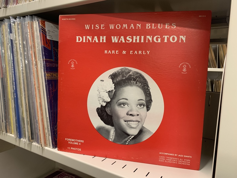 Wise Woman Blues: Dinah Washington, Rare and Early. A vinyl featuing Dinah Washington wearing a flower in her hair.