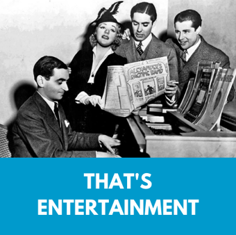 That's entertainment. Irving Berlin at the piano with singers holding "Alexander's Ragtime Band" sheet music.