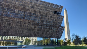 The Smithsonian Musum of African American History and Culture in front of the Lincoln Memorial.