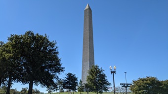 The Washington Monument against a blue sky.