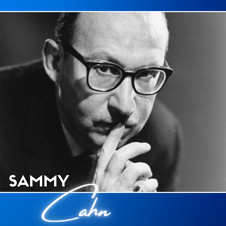Sammy Cahn with a plantive look on his face in horn rimmed glasses.
