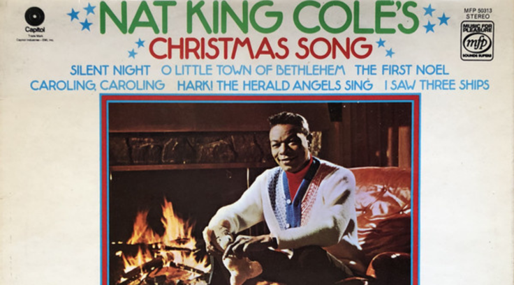 Nat King Cole's Christmas Song. Nat sits relaxed in front of a blazing fire.