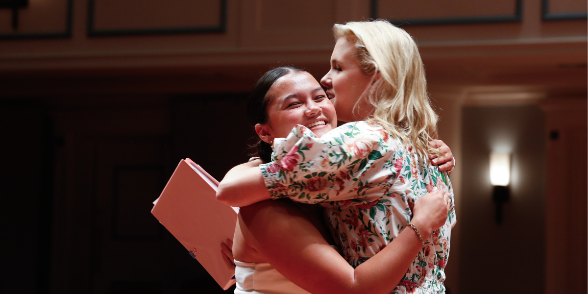 Broadway and television actress Ginna Claire Mason embraces a Songbook Academy student after reaching a momentous breakthrough.