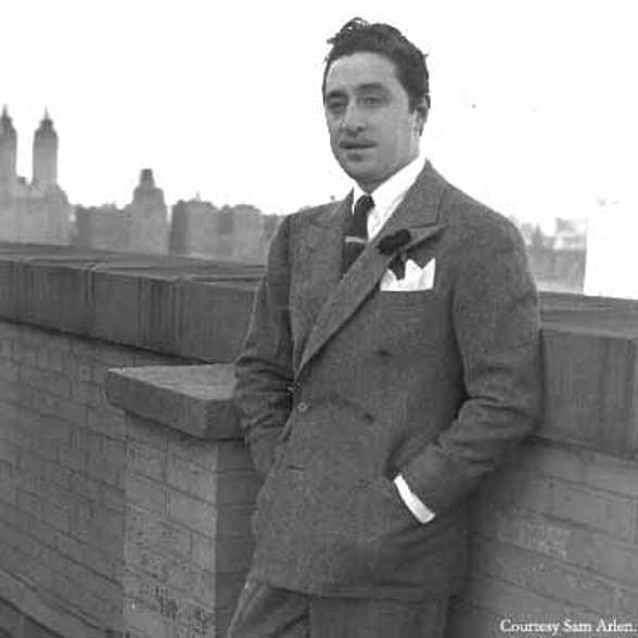 A young Harold Arlen in a tweed suit leans against a short wall with the London skyline in the background.