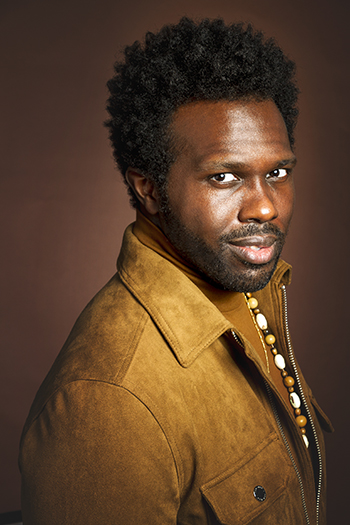 Actor-singer Joshua Henry smiles for a photo.